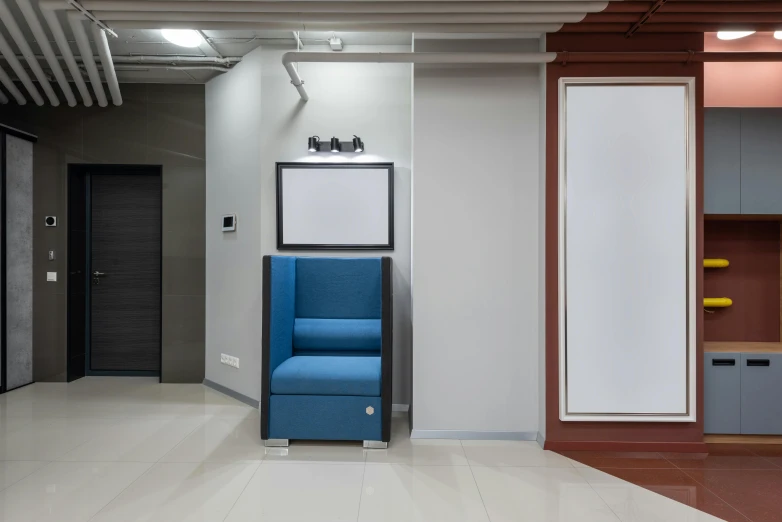 a blue chair sitting in the middle of a room, a poster, unsplash, located in hajibektash complex, opposite the lift-shaft, azamat khairov, office interior