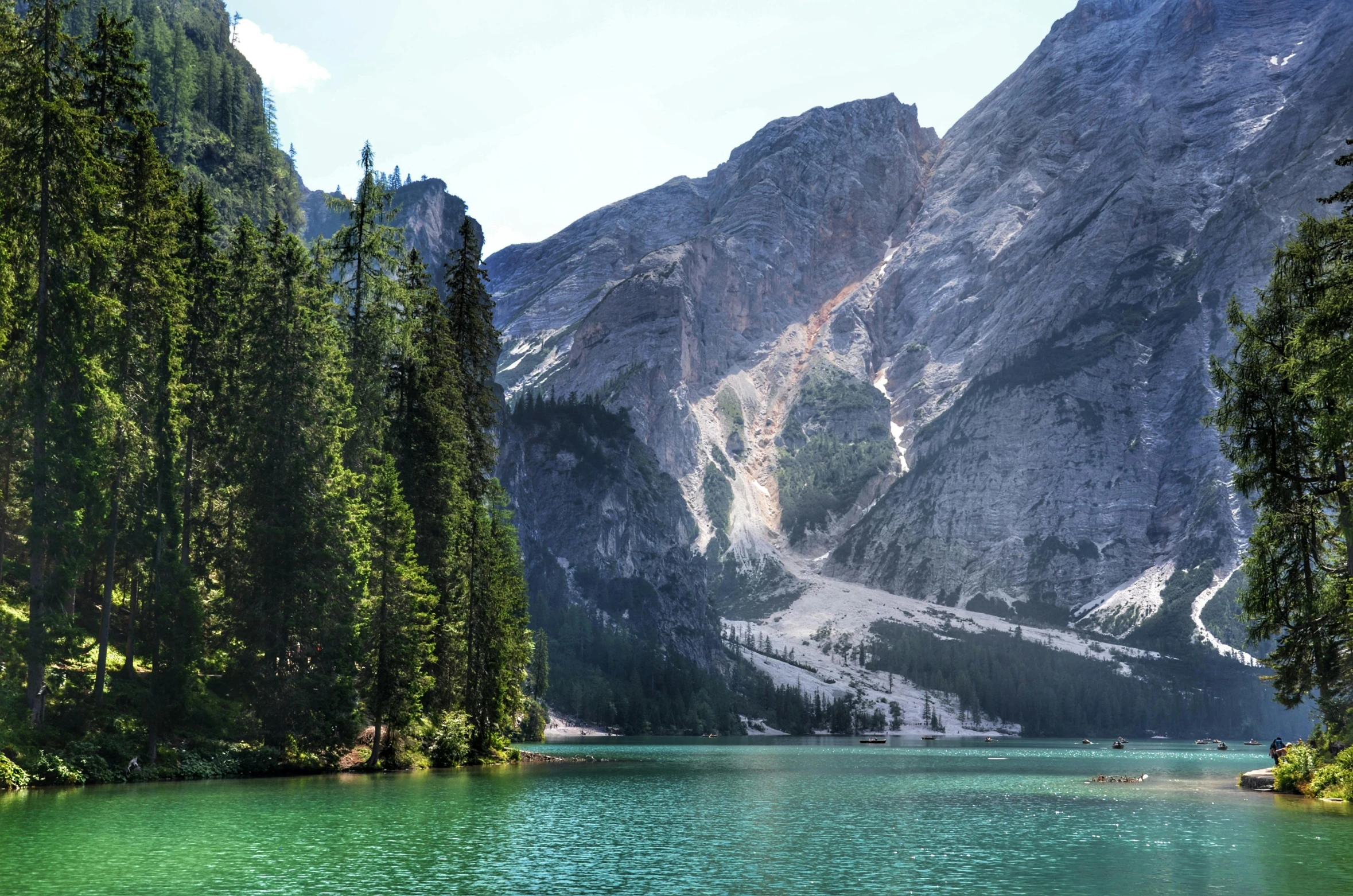 a large body of water surrounded by trees, by Sebastian Spreng, pexels contest winner, hurufiyya, dolomites, blue and green water, geology, conde nast traveler photo