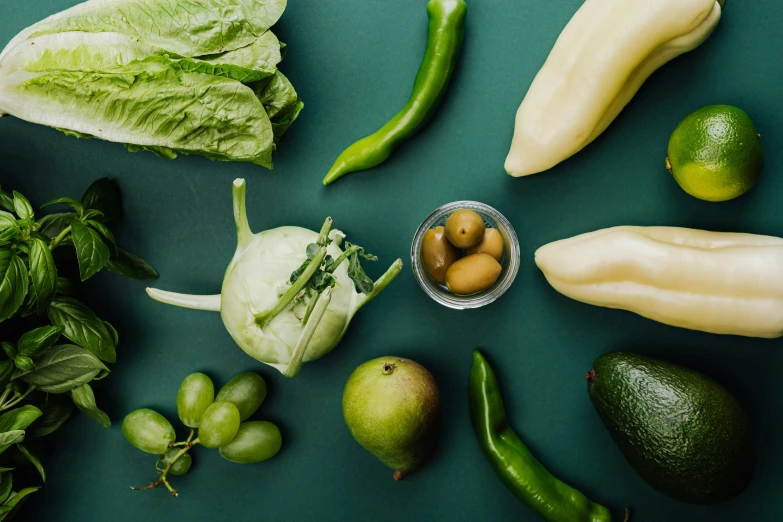 a number of fruits and vegetables on a table, inspired by Ceferí Olivé, unsplash, pale green glow, full product shot, ignant, lettuce