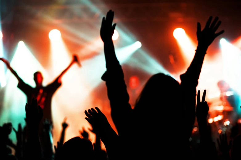 a crowd of people at a concert with their hands in the air, an album cover, pexels, thumbnail, getty images, siluettes, very expressive