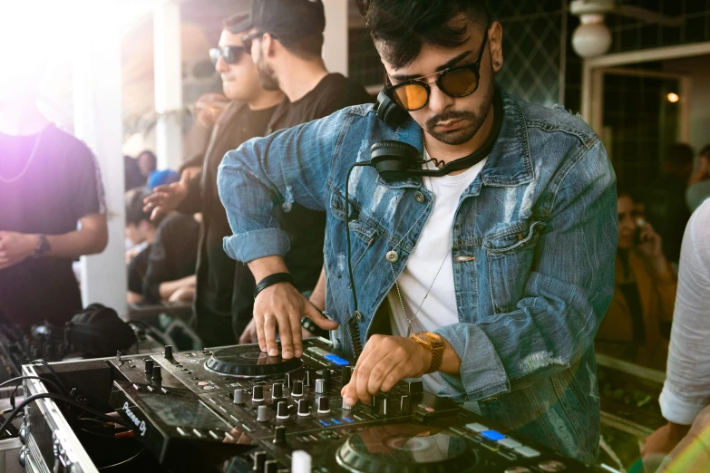 a man that is playing some kind of music, trending on pexels, dj at a party, zayn malik, shades, borja