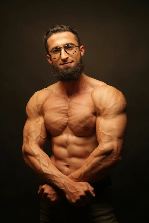 a man with a beard and glasses posing for a picture, an album cover, by Ahmed Yacoubi, bulging muscles, 21 years old, huge veins, muslim