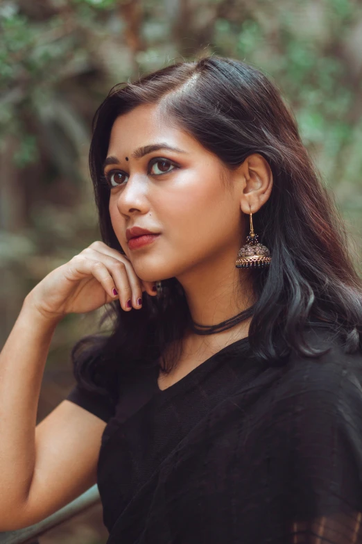 a woman in a black dress posing for a picture, hindu aesthetic, earring, promo image, multiple stories