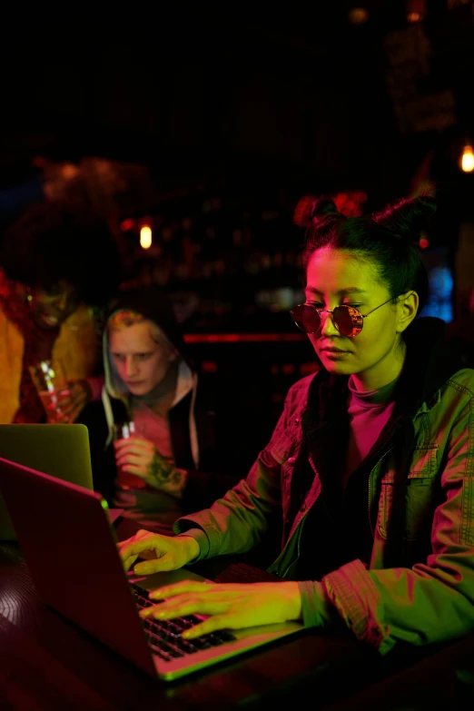 a man sitting in front of a laptop computer, by Daren Bader, happening, chinatown bar, beautiful female neuromancer, 15081959 21121991 01012000 4k, production photo