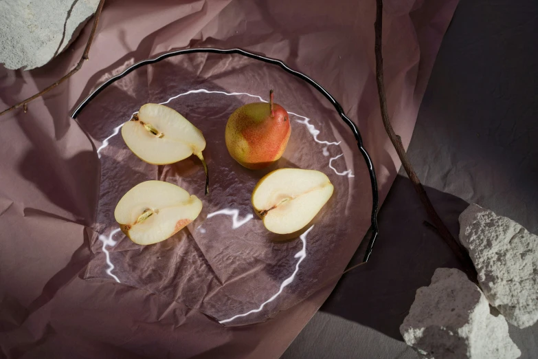 a glass bowl filled with sliced apples on top of a table, inspired by Anna Füssli, soft vinyl, pear, shadows, plates