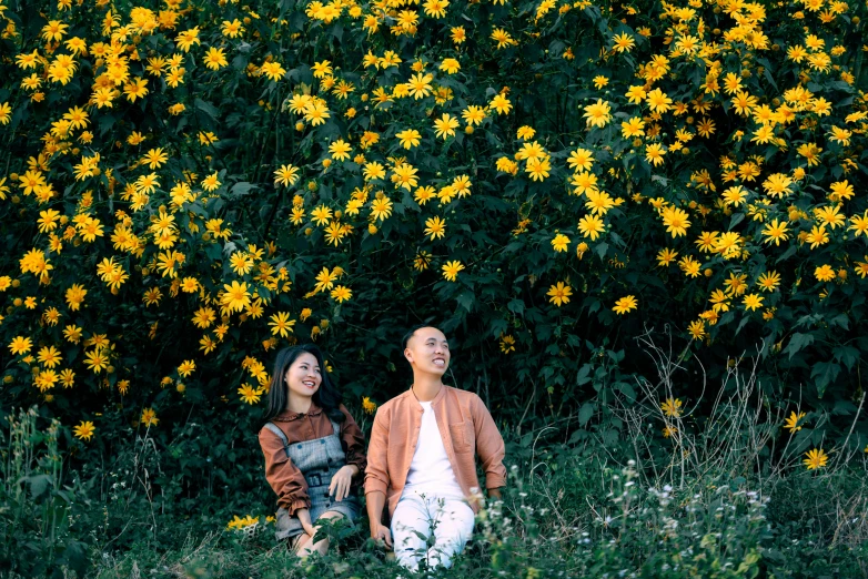 a man and a woman sitting in a field of yellow flowers, unsplash, avatar image, background image, do hoang tuong artwork, outdoor photo