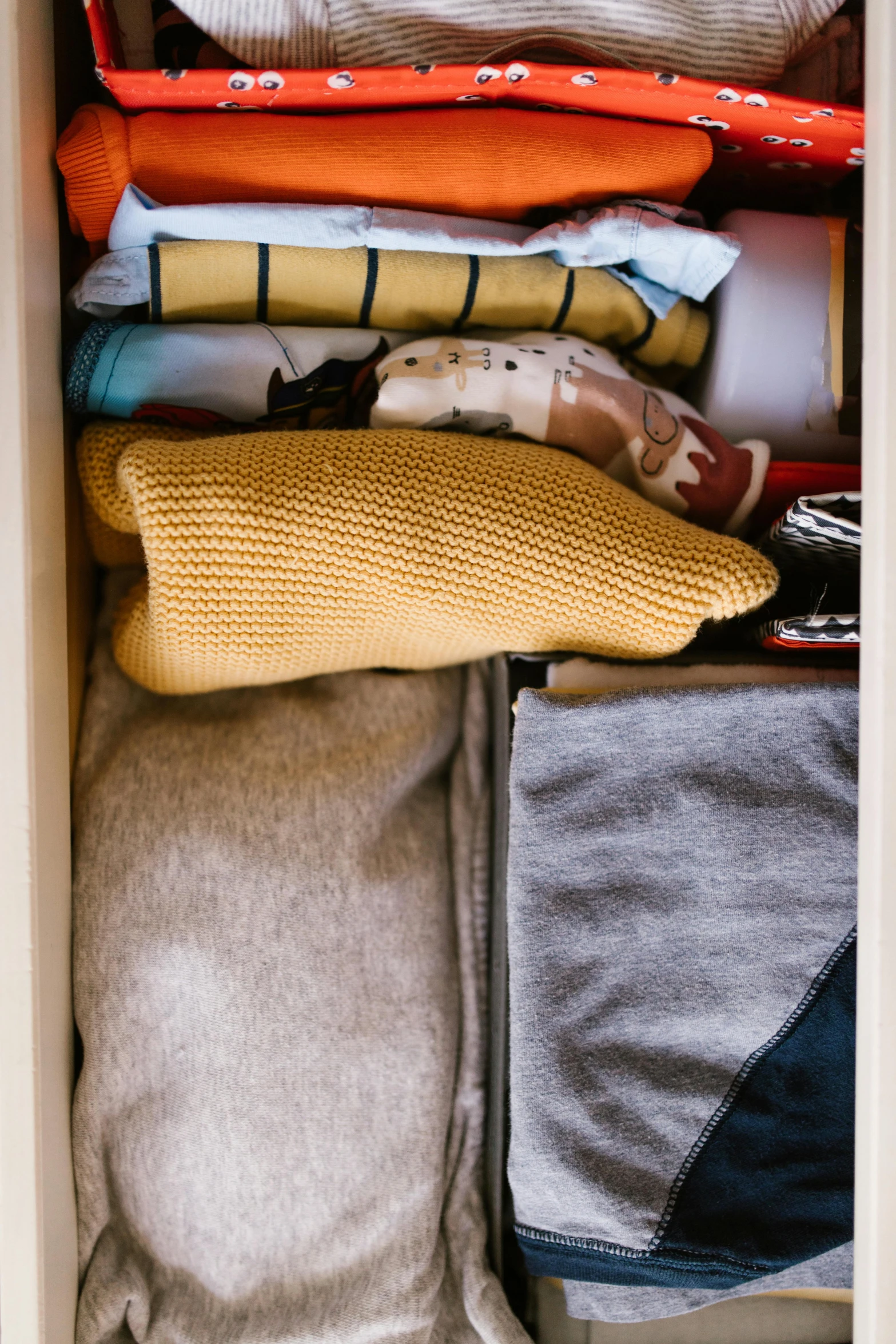 a close up of a drawer filled with clothes, rectangle, dwell, multicolored, layers