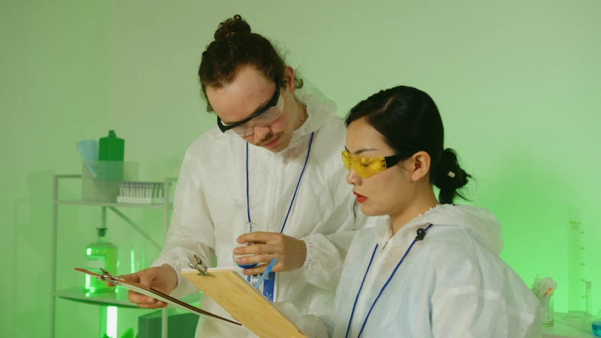 a couple of people standing next to each other, pexels, academic art, experimenting in her science lab, avatar image, mid shot photo, high temperature
