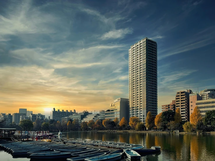 a group of boats sitting on top of a body of water, inspired by Ricardo Bofill, pexels contest winner, brutalism, city buildings on top of trees, 8k hdr hyperrealism, santiago calatrava, colossal tower