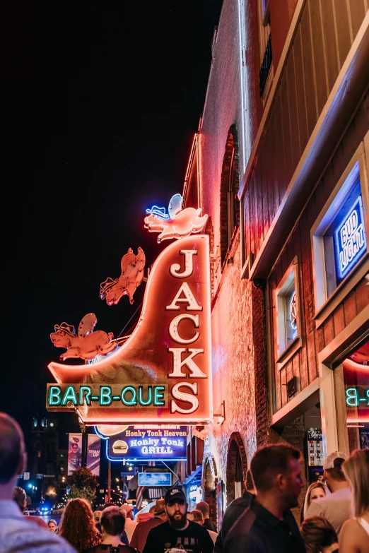 a crowd of people standing outside of a bar, by Drew Tucker, pexels contest winner, gigantic neon signs, alan jackson, duck, buildings