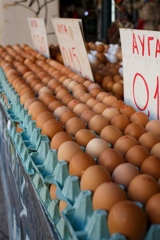 a bunch of eggs sitting on top of a table, inside an arabian market bazaar, 2 5 6 x 2 5 6 pixels, cyprus, in rows