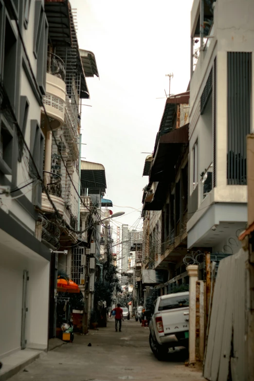a city street filled with lots of tall buildings, dada, old city, bangkok, streets of salvador, looking sad