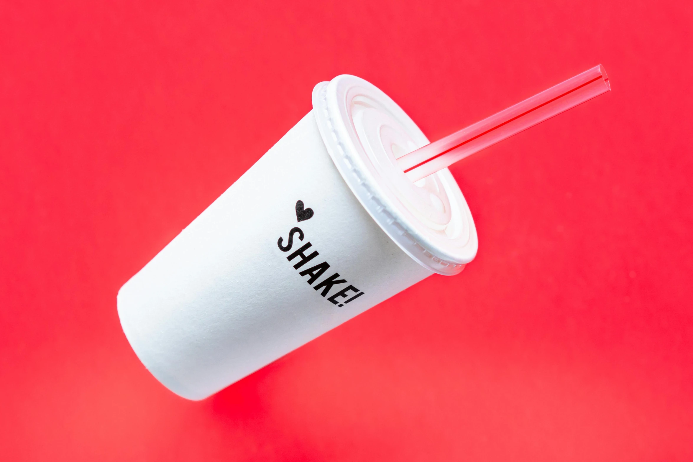 a paper cup with a straw sticking out of it, an album cover, trending on pexels, shakti, red neon details, skincare, large tall