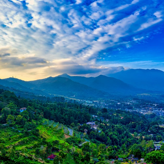 a view of the mountains from the top of a hill, by Meredith Dillman, pexels contest winner, sumatraism, kerala village, blue, thumbnail, wide angle shot 4 k hdr