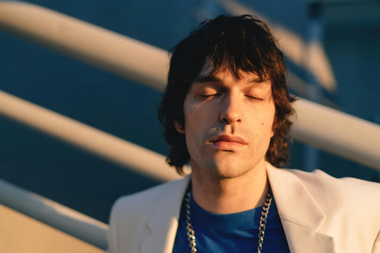 a close up of a person wearing a white jacket, an album cover, unsplash, adam driver behind, rex orange county, in the sun, curtain bangs