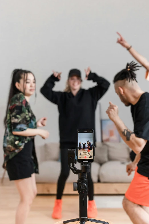 a group of people that are standing in a room, dancing, shot with hasselblade camera, tiktok video, promotional image