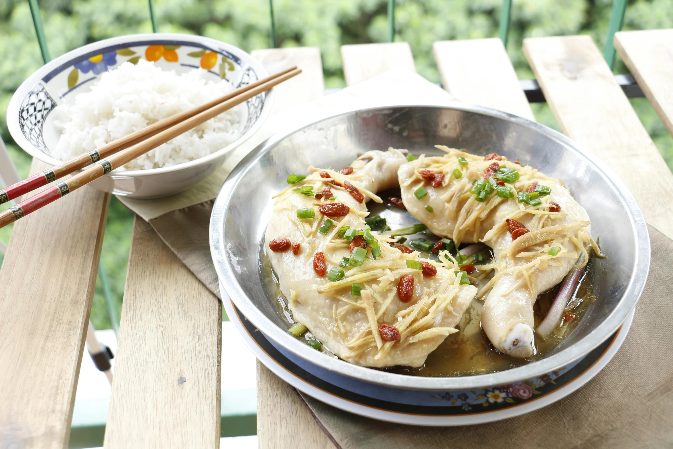 a plate of food sitting on top of a wooden table, inspired by Xie Huan, anthropomorphized chicken, 千 葉 雄 大, a blond, al fresco