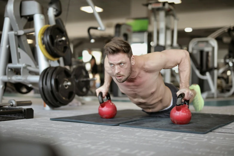 a man doing push ups with kettlebells in a gym, a portrait, pexels contest winner, figuration libre, avatar image, lachlan bailey, attractive face and body, 2 0 0 0's photo