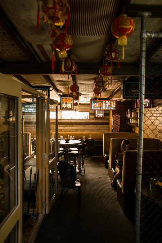 a room filled with lots of tables and chairs, mingei, tokyo alleyway, cinematic shot, inside of a car, small chin