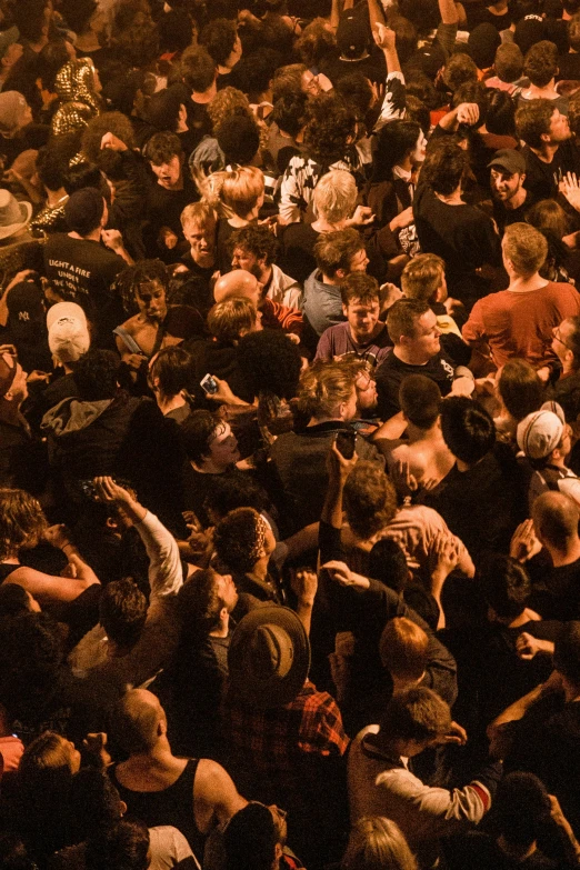 a large crowd of people at a concert, an album cover, by Matt Stewart, pexels contest winner, grindcore, melbourne, photo from above, the pits of hell