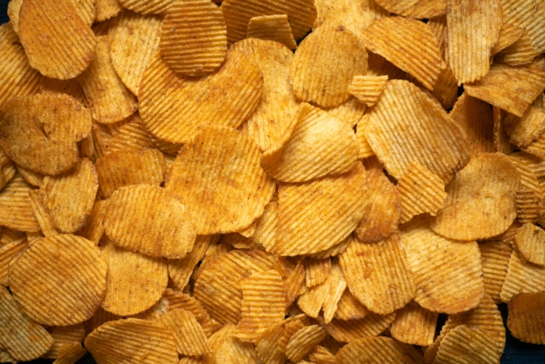 a pile of potato chips sitting on top of a table, exaggerated texture, eeriewave, 3 4 5 3 1, crisp contour - lines