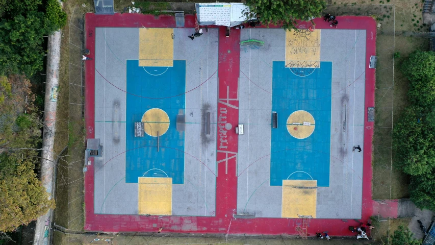 an aerial view of a basketball court surrounded by trees, an album cover, by Attila Meszlenyi, dribble, street art, helipad, 15081959 21121991 01012000 4k, india, panoramic shot