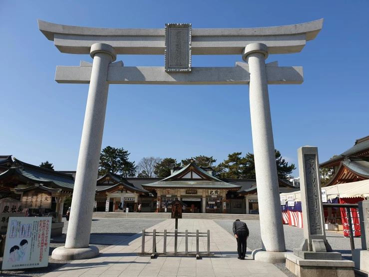 a person standing in front of a large white gate, a statue, sōsaku hanga, pillars and arches, 🚿🗝📝, rectangle, japanese shrine