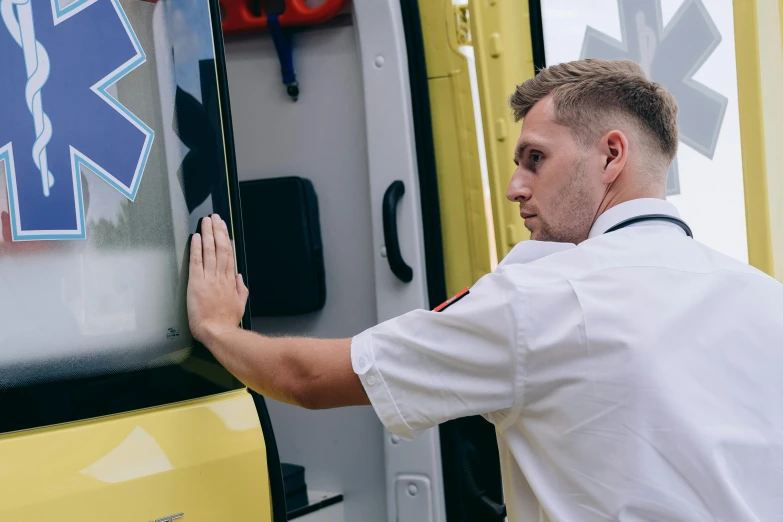 a man that is standing in front of a ambulance, profile image