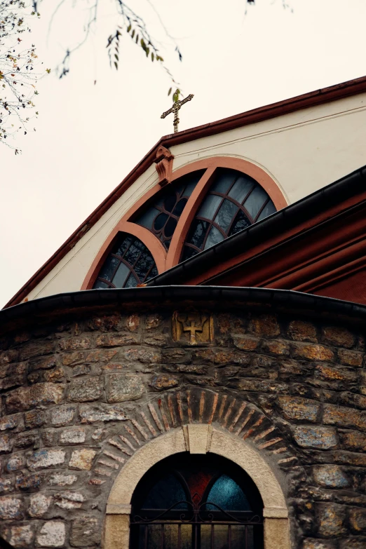 a clock that is on the side of a building, an album cover, inspired by Károly Markó the Elder, romanesque, 1996), holy cross, detail structure, rounded roof