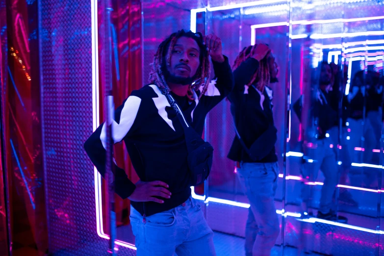 a man that is standing in front of a mirror, an album cover, pexels contest winner, neon lighting medium full shot, future clothing, thumbnail, playboi carti portrait