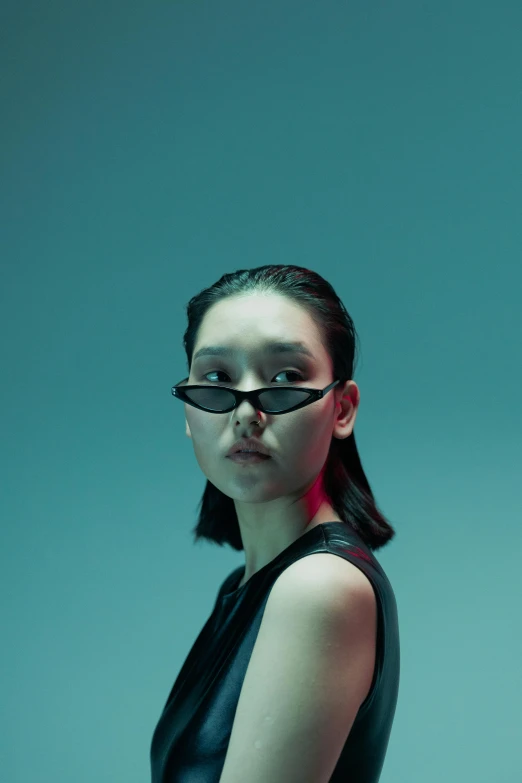 a woman in a black dress and glasses, inspired by Gao Cen, unsplash, neo-dada, hair in slick low ponytail, hypebeast, nvidia promotional image, rays