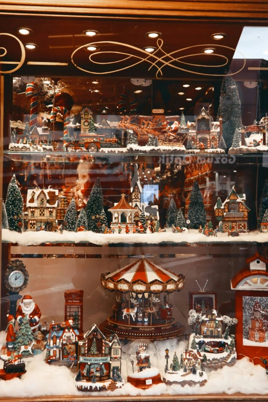 a display case filled with lots of christmas figurines, inspired by Rudolph F. Ingerle, folk art, tabletop model buildings, 1997 ), 1996)