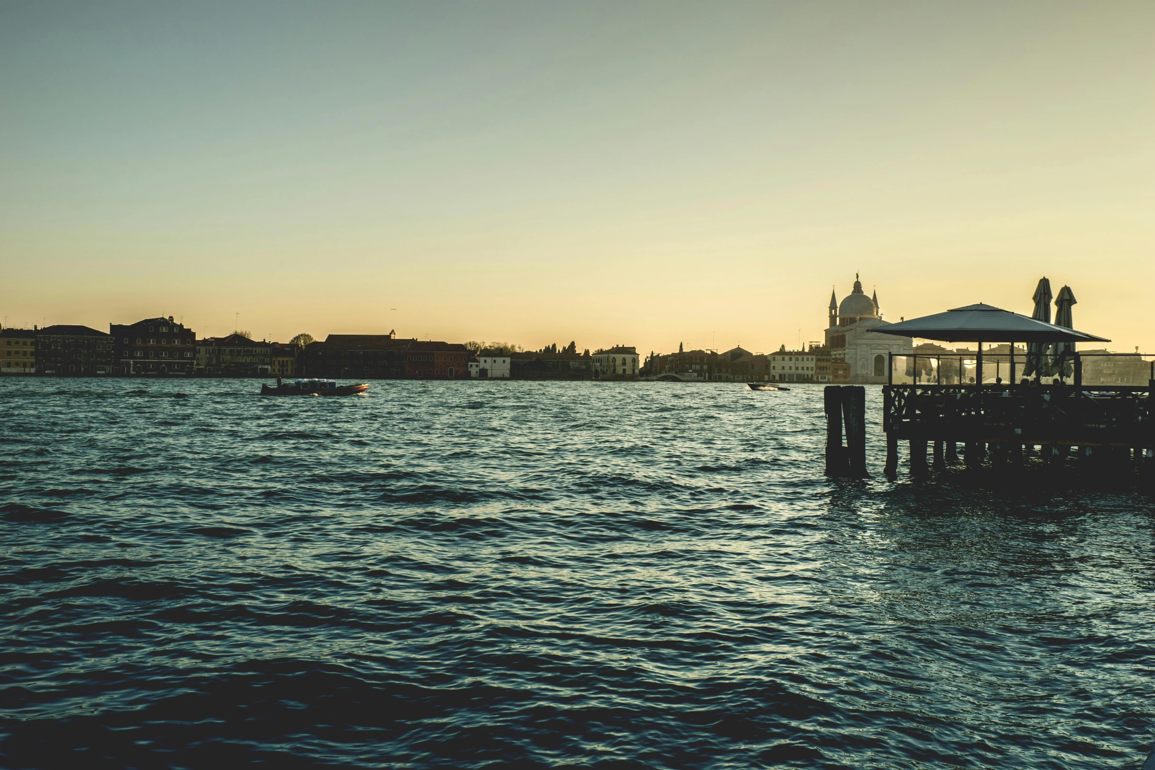 a pier in the middle of a large body of water, pexels contest winner, renaissance, venice biennale's golden lion, late afternoon, album cover, sleepy