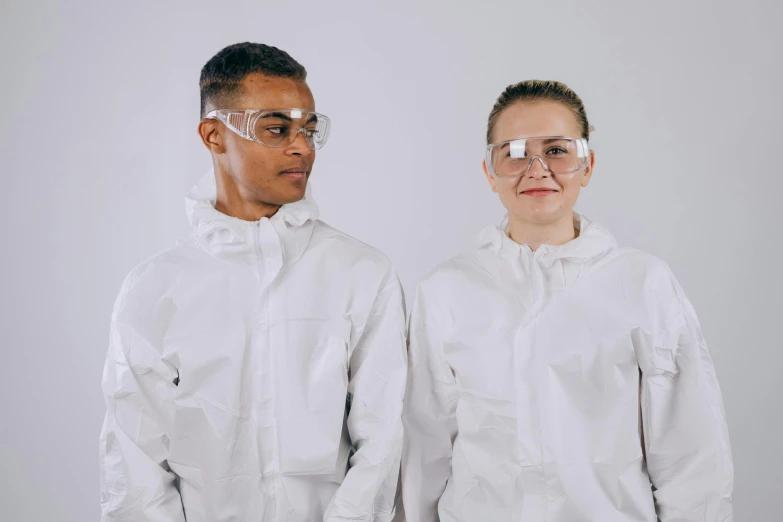 a couple of people standing next to each other, wearing goggles, white sleeves, cleanest image, diverse