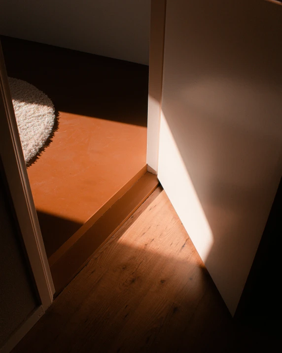 a door is open in a dark room, an album cover, inspired by Elsa Bleda, unsplash contest winner, light and space, gradient brown to white, floors, sun puddle, a high angle shot