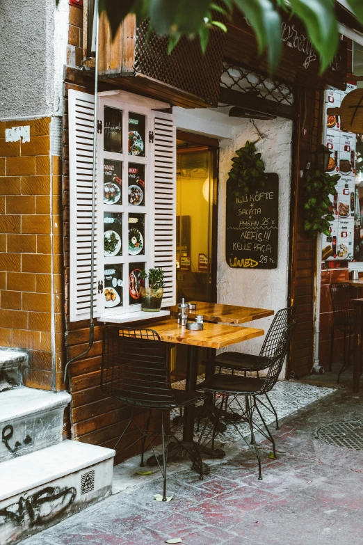 a couple of tables that are outside of a building, pexels contest winner, spanish ghibli alleyway, cosy atmosphere, retro style ”, profile image