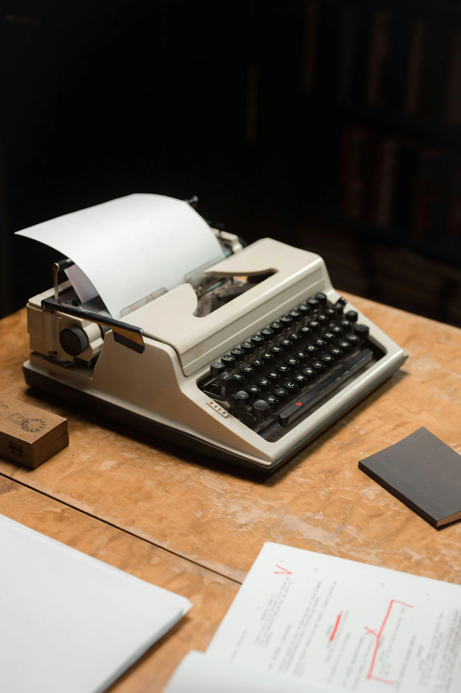 a typewriter sitting on top of a wooden table, ivory, promo image, multiple stories, 1 9 8 0 s tech