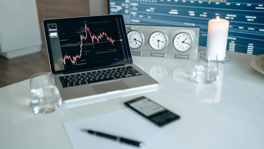 a laptop computer sitting on top of a white table, trending on pexels, analytical art, tubes and gauges, traders, during the night, crypto