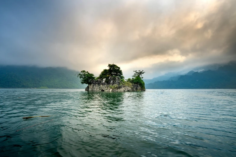 a small island in the middle of a body of water, inspired by Pierre Pellegrini, unsplash contest winner, sumatraism, guangjian, looking towards camera, conde nast traveler photo