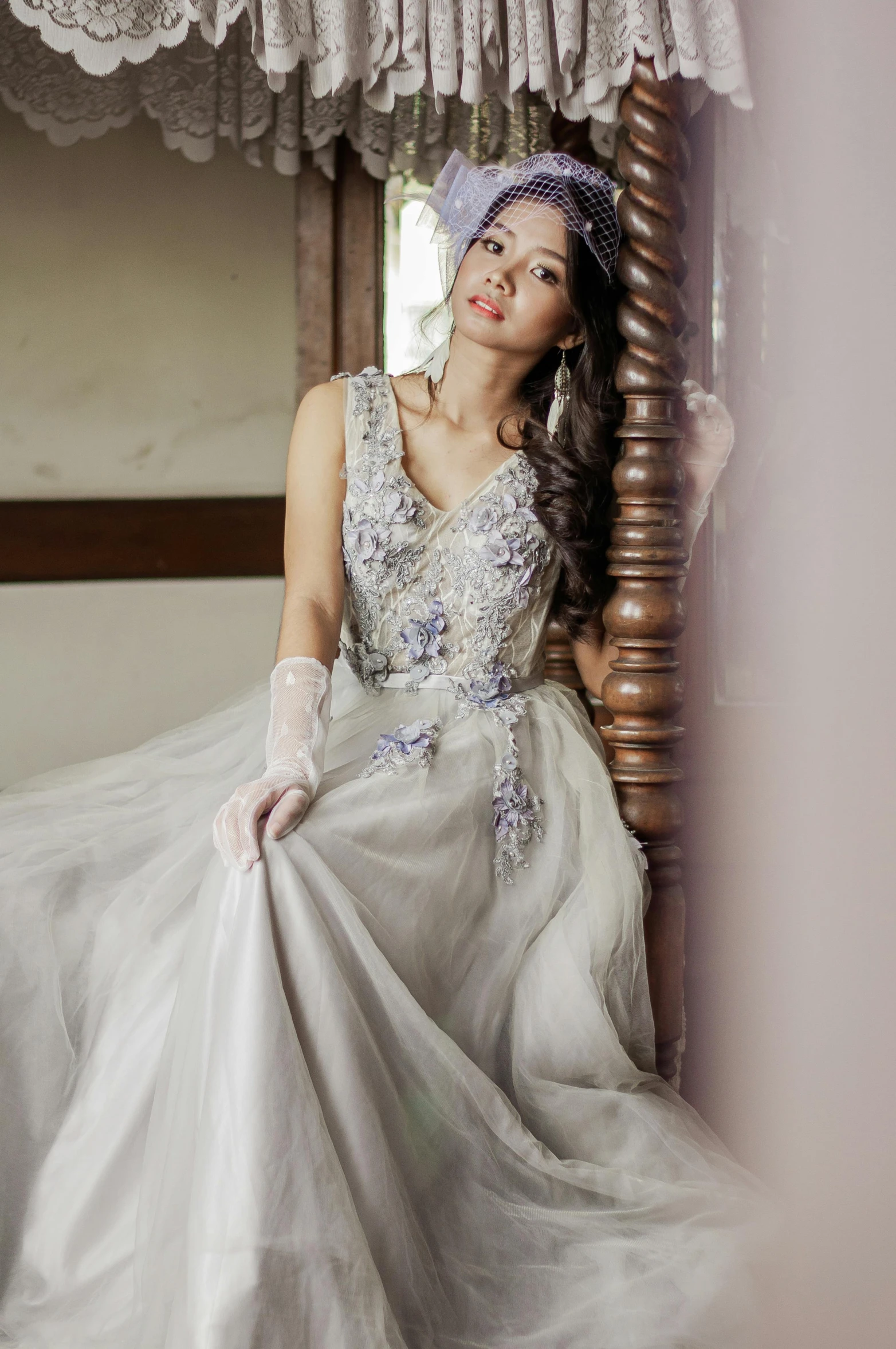 a woman in a wedding dress sitting on a bed, by Natasha Tan, baroque, hues of subtle grey, elegant evening gowns!, dress, cindy avelino