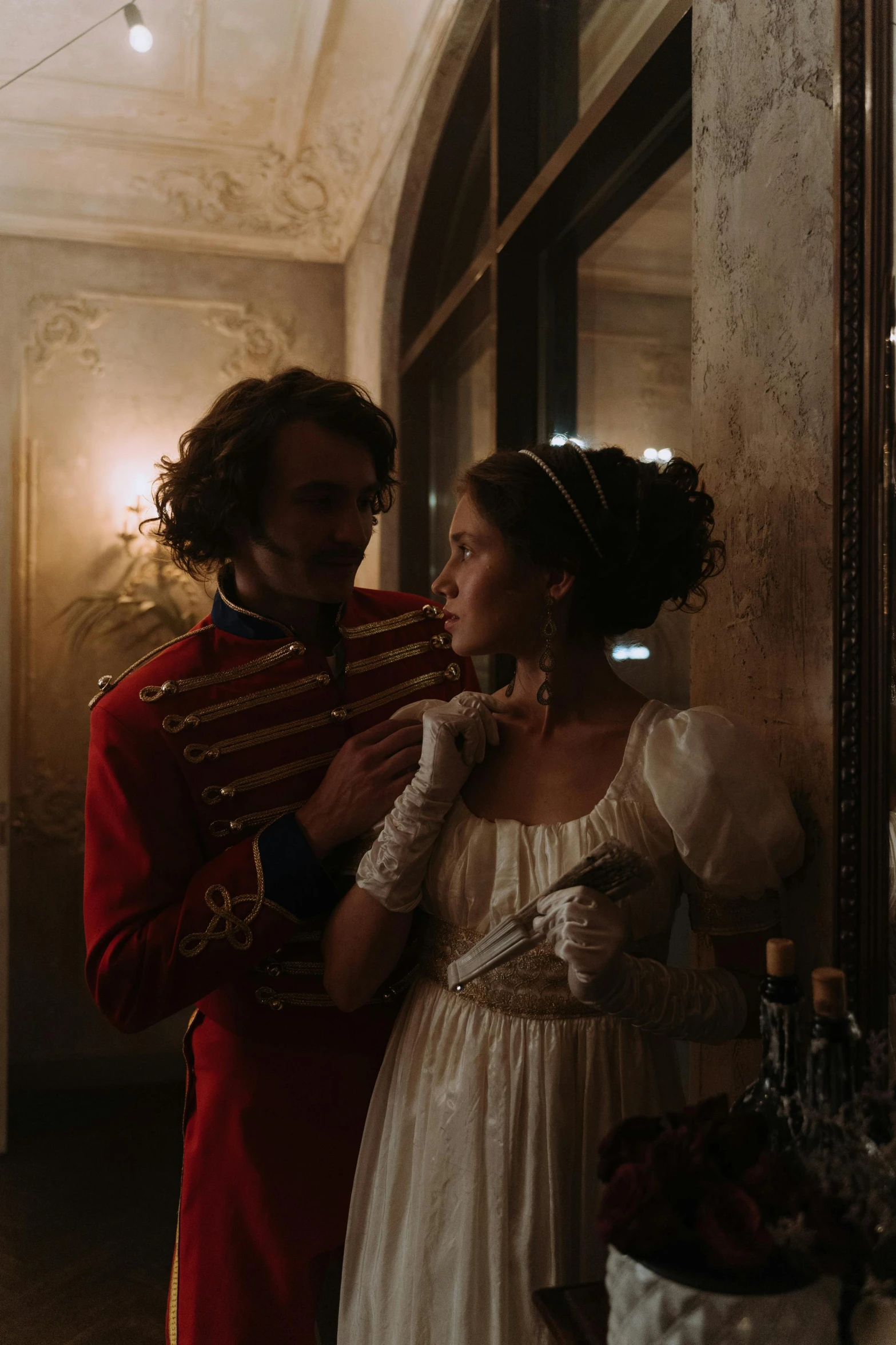 a man standing next to a woman in a dress, inspired by Karl Bryullov, denis villeneuve cinematography, vhs footage still, victoria, [ theatrical ]