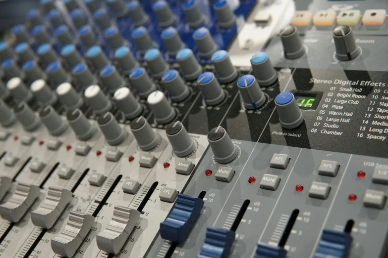 a close up of a mixing board in a recording studio, by David Simpson, pexels, blue and grey theme, avatar image