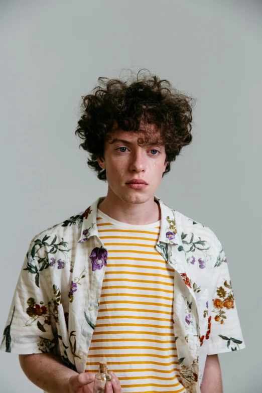 a man standing with his hands in his pockets, an album cover, trending on pexels, renaissance, sophia lillis, floral clothes, headshot profile picture, adam ondra