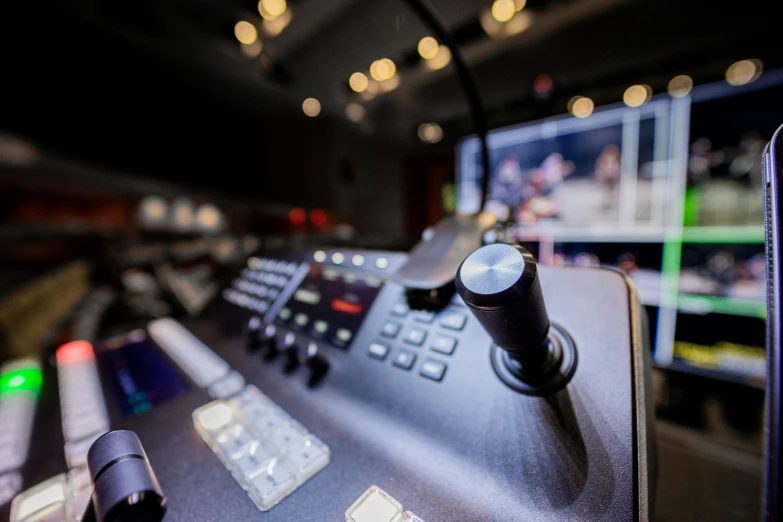 a close up of a control panel in a recording studio, unsplash, happening, footage of a theater stage, inside a grand, looking towards the camera, amanda lilleston