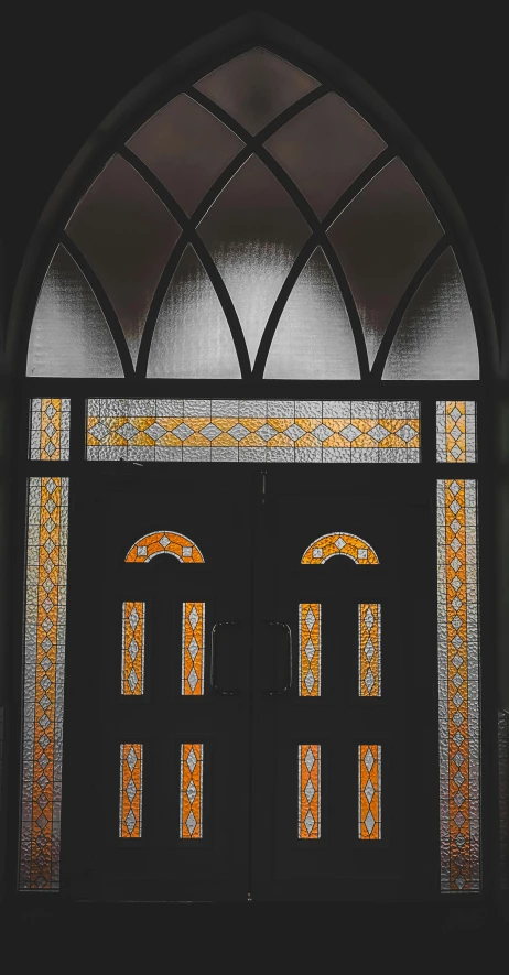 a couple of doors that are next to each other, by Jessie Algie, unsplash, art nouveau, gothic stained glass style, islamic, brown, portrait photo