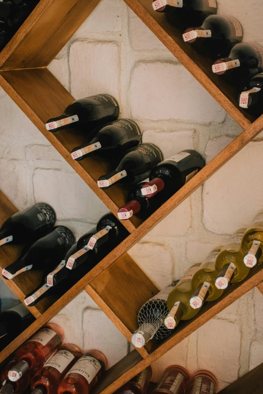 a wine rack filled with lots of bottles of wine, pexels contest winner, labels, bubbly, assymetrical, profile image