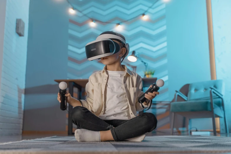 a little boy sitting on the floor wearing a virtual reality headset, a 3D render, inspired by Jean Tabaud, pexels, interactive art, cyberpunk childrens bedroom, avatar image