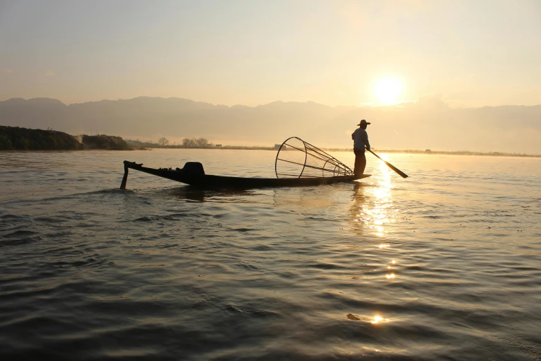 a man standing on top of a boat in the water, a picture, unsplash contest winner, hurufiyya, myanmar, sunlight glistening, soup, youtube thumbnail