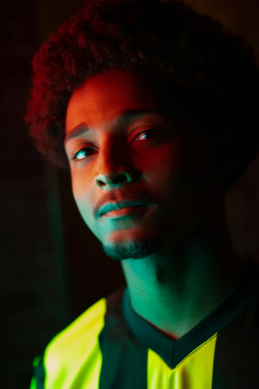 a close up of a person wearing a soccer uniform, pexels contest winner, renaissance, wearing hi vis clothing, afro tech, portrait soft low light, very handsome