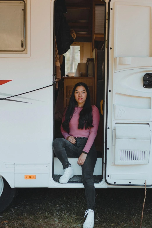 a woman sitting in the doorway of a camper, pexels contest winner, renaissance, young asian woman, profile image, proud looking, pink